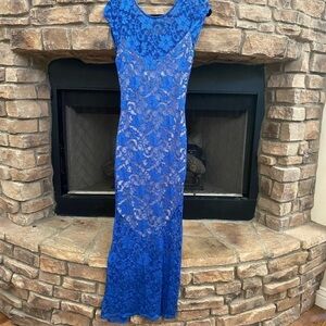 NWOT blue lace mermaid gown. Tan slip underneath covers bodice to knees. Stretch